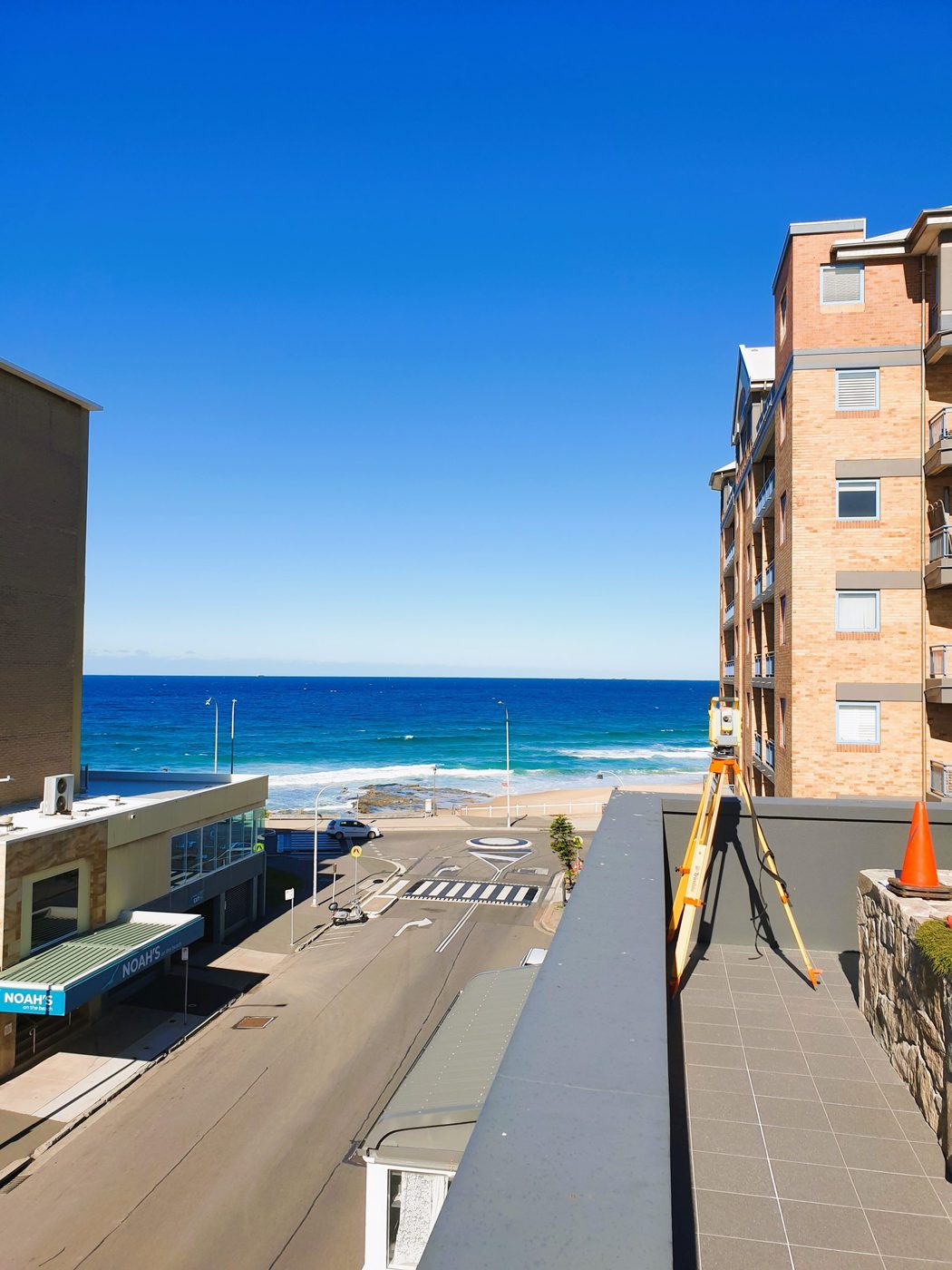 A rooftop survey overlooking Newcastle beach