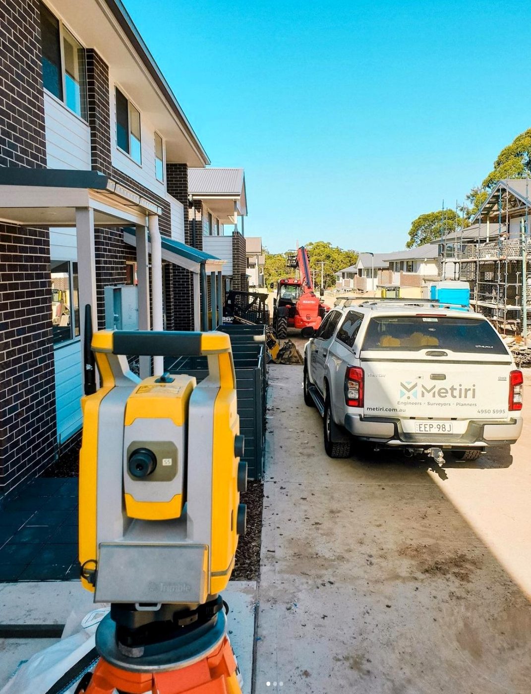 Set-out underway on a townhouse development, Metiri ute on site